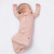 The thoughtful design easily converts from a gown to a goumi sleeper, providing versatility for day and night.