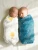 This exquisite set features two luxuriously soft, 100% GOTS certified organic cotton muslin swaddles, thoughtfully designed to bring comfort and serenity to your little one.