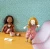 Violette is a medium size rag doll with a soft face delicately illustrated and printed, and long blond hair in rolled jersey ponytails.