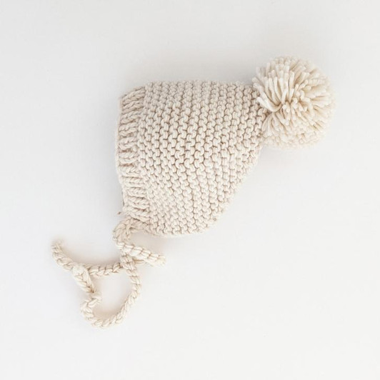 Elevate your little one's winter style with our Natural Garter Stitch Knit Bonnet.
