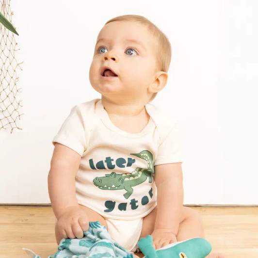 The Emerson and Friends Later Gator onesie features a charming design, adding a touch of fun to your baby's wardrobe.