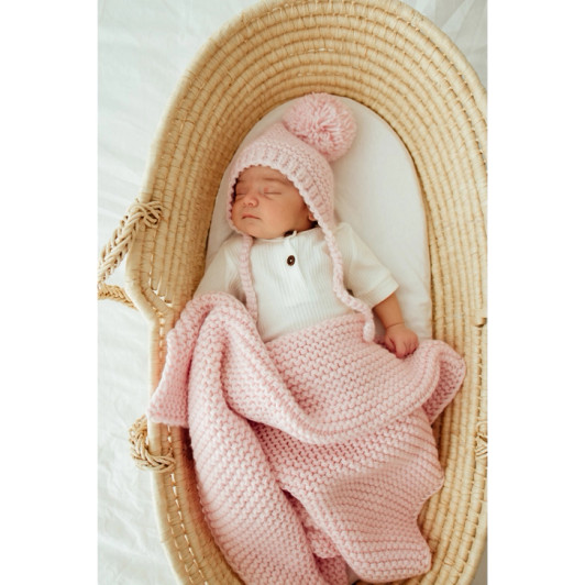 The subtle blush blanket hue adds a touch of elegance to any nursery or makes a thoughtful gift.