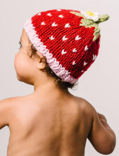 Embrace the charm of The Blueberry Hill with the Addie Strawberry Hat. This delightful accessory is a must-have for anyone who appreciates handcrafted quality and playful design.