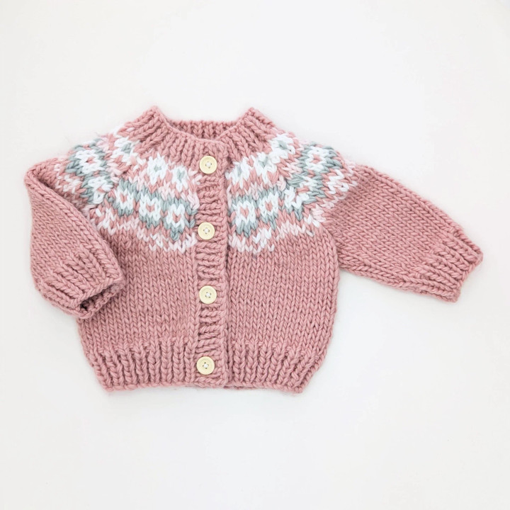 Wrap your little one in festive cheer with the Fairisle Rosy Cardigan Sweater from Huggalugs