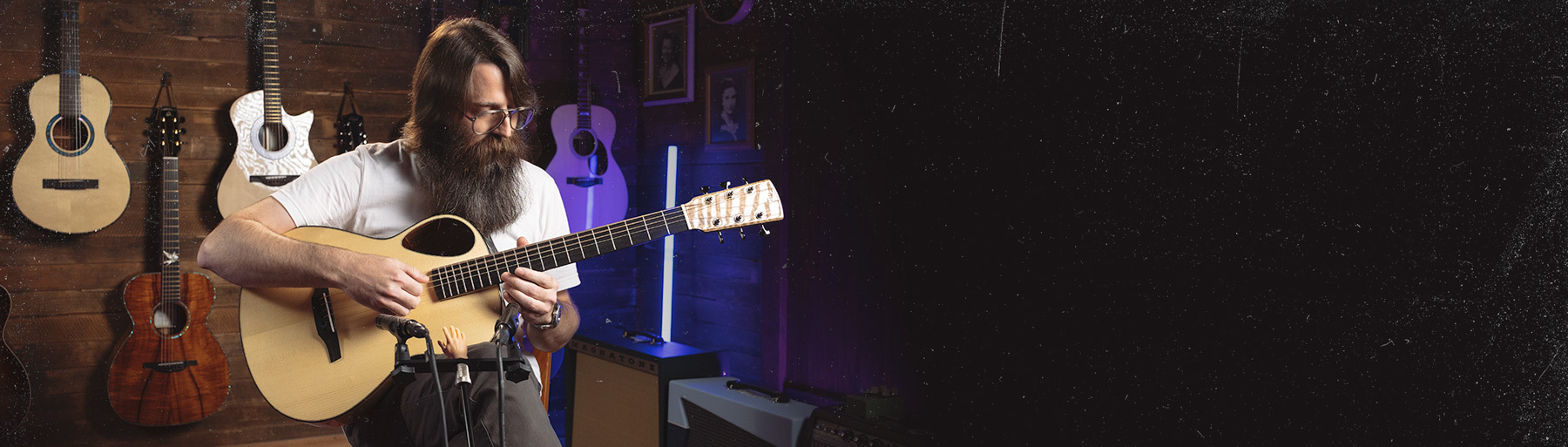 Man Playing Acoustic Guitar in Studio