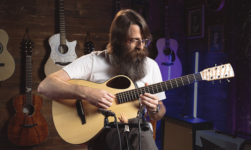 Man Playing Acoustic Guitar in Studio