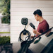 Man charging his car with a Wallbox Pulsar Plus Charger