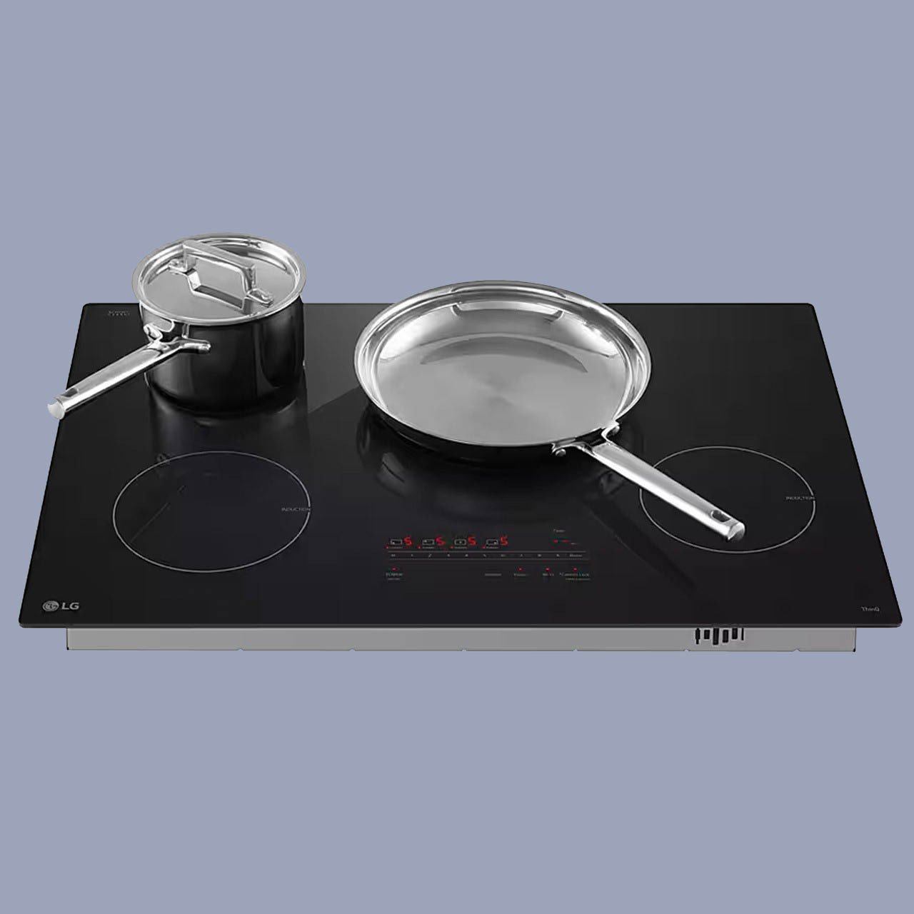 a pot and pan sitting on a 4 element cooktop