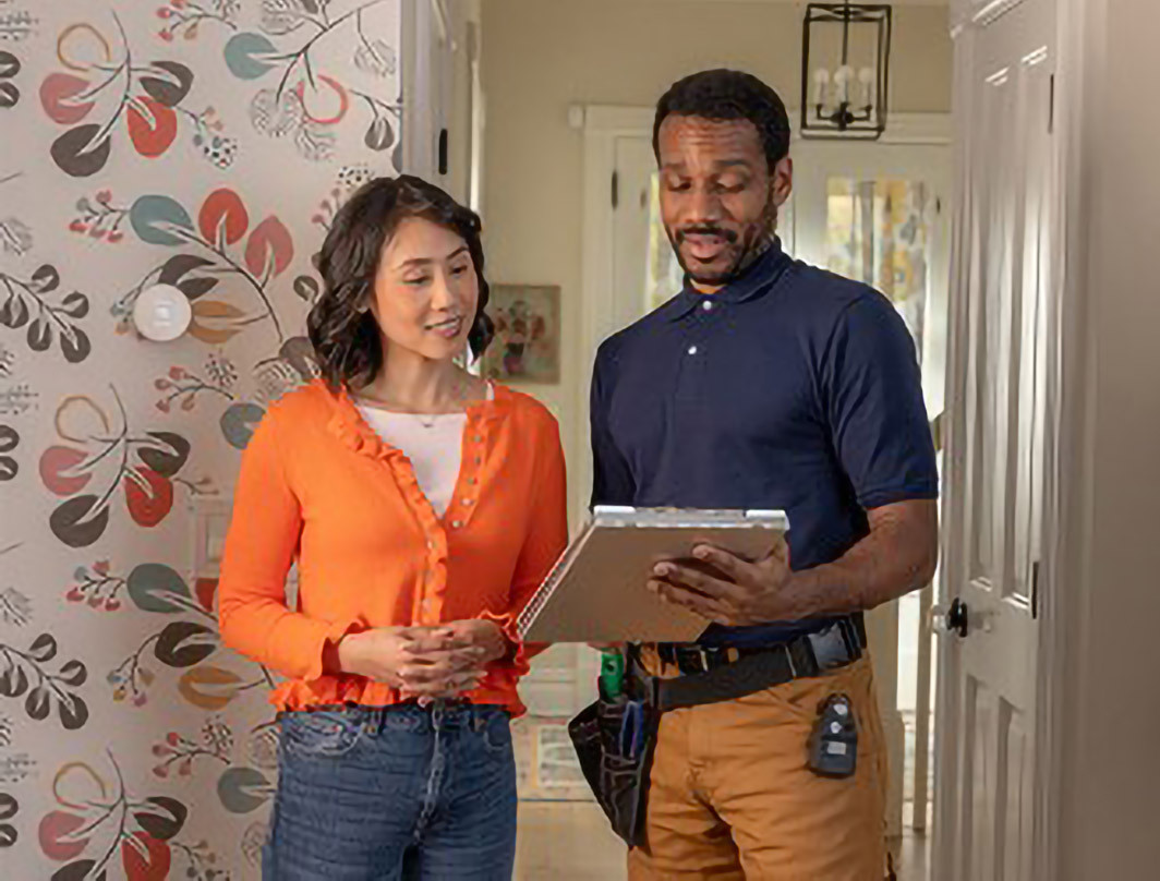 woman and man reviewing home weatherization