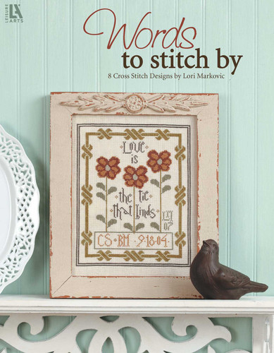 Words To Stitch By: 8 Cross Stitch Designs by Lori Markovic book cover by Lori Markovic