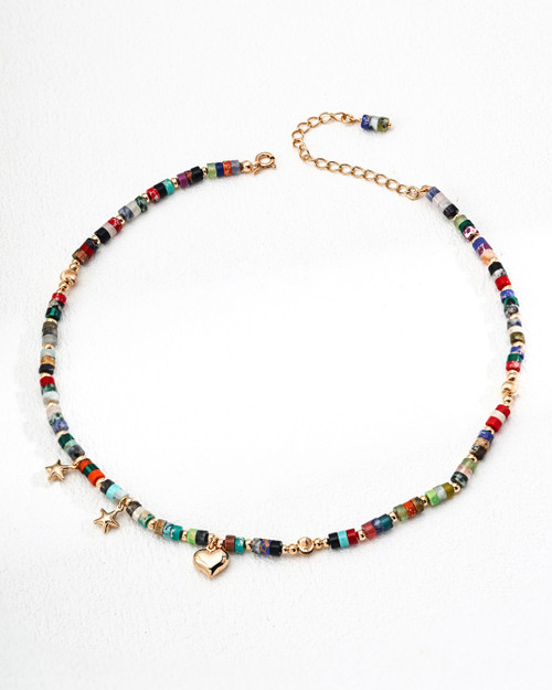 Summer Sea bracelet with multicolor stones and three gold pendants (two stars, one heart). Adjustable gold chain clasp, perfect for stacking wear.