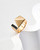 Simple Ring close-up: 925 gold-plated silver with black enamel geometric accents, mirror polish finish, size-adjustable band