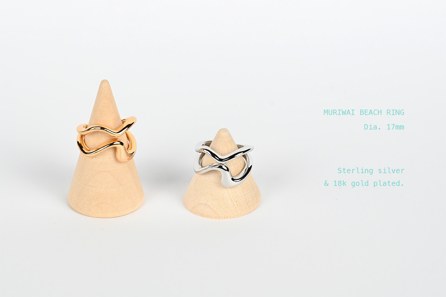 Gold vs silver muriwai beach rings - Sunset warmth meets black sand reflection in hand-forged metal curves