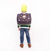 School satchel with patches and embroidery, creating a galactic theme.