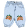 front view of Stella McCartney Kids blue cotton baggy trousers with carrot graphics. features an elasticated waistband, side slit pockets and fitted cuffs.