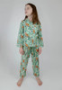 Full-view of Jungle Pyjamas accentuated with pearlized buttons, emerald green piping, and a functional chest pocket