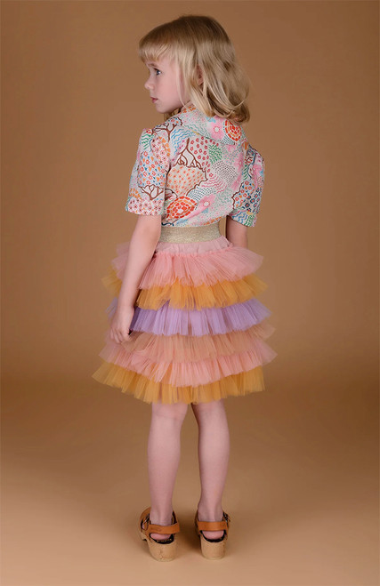 "Child making a grand entrance at a party wearing the statement piece, Enchanted Rainbow - Classic Voluminous Tulle Skirt." "Child making a grand entrance at a party wearing the statement piece, Enchanted Rainbow - Classic Voluminous Tulle Skirt."