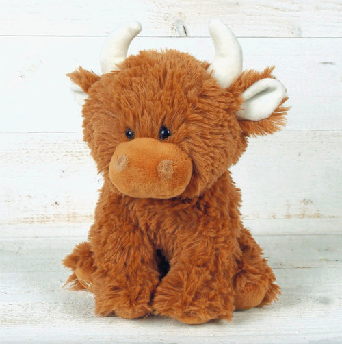 Adorable brown Scottish Highland Cow plush toy with big, soulful eyes, soft, fluffy exterior, baby safe and machine washable, perfect for cuddles from birth.