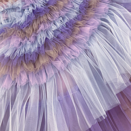 Close-up showcasing the soft, flowing tulle layers of the Swan dress. Close-up showcasing the soft, flowing tulle layers of the Swan dress.
