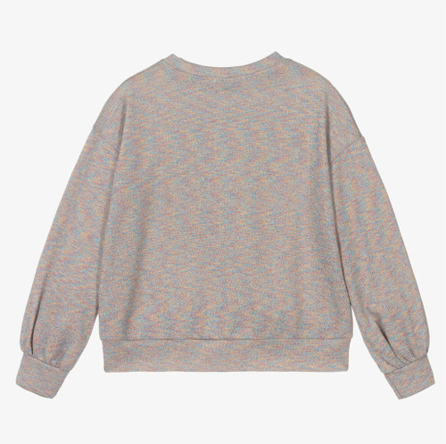 European-made sweater with a vibrant rabbit centerpiece. European-made sweater with a vibrant rabbit centerpiece.