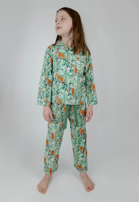Full-view of Jungle Pyjamas accentuated with pearlized buttons, emerald green piping, and a functional chest pocket Full-view of Jungle Pyjamas accentuated with pearlized buttons, emerald green piping, and a functional chest pocket