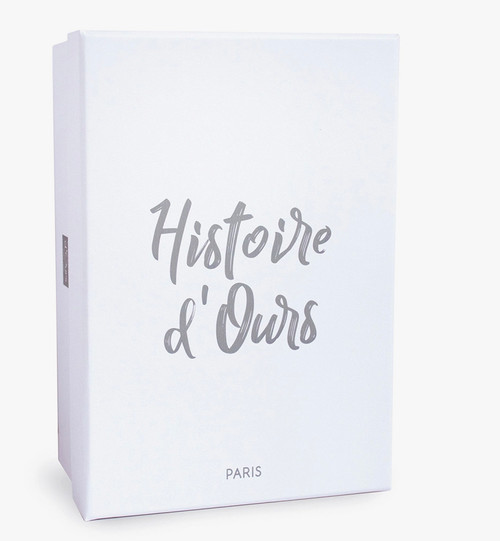 French-designed baby slippers with cute bunny and rattle, perfect for infants.