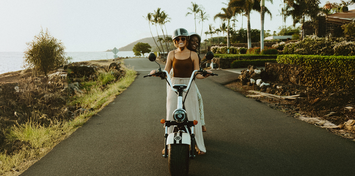 woman riding scooter