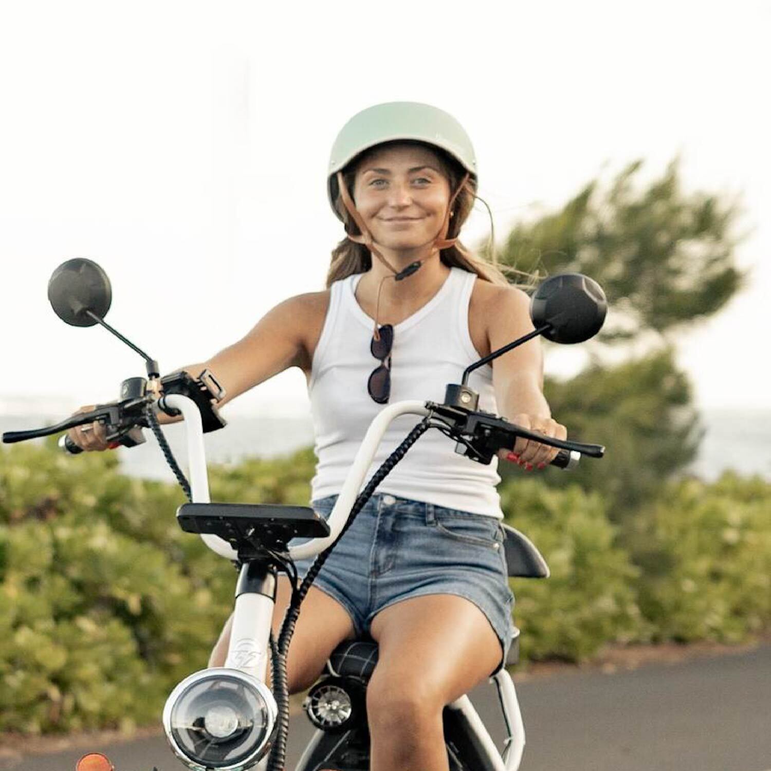 aerial shot of road by the ocean