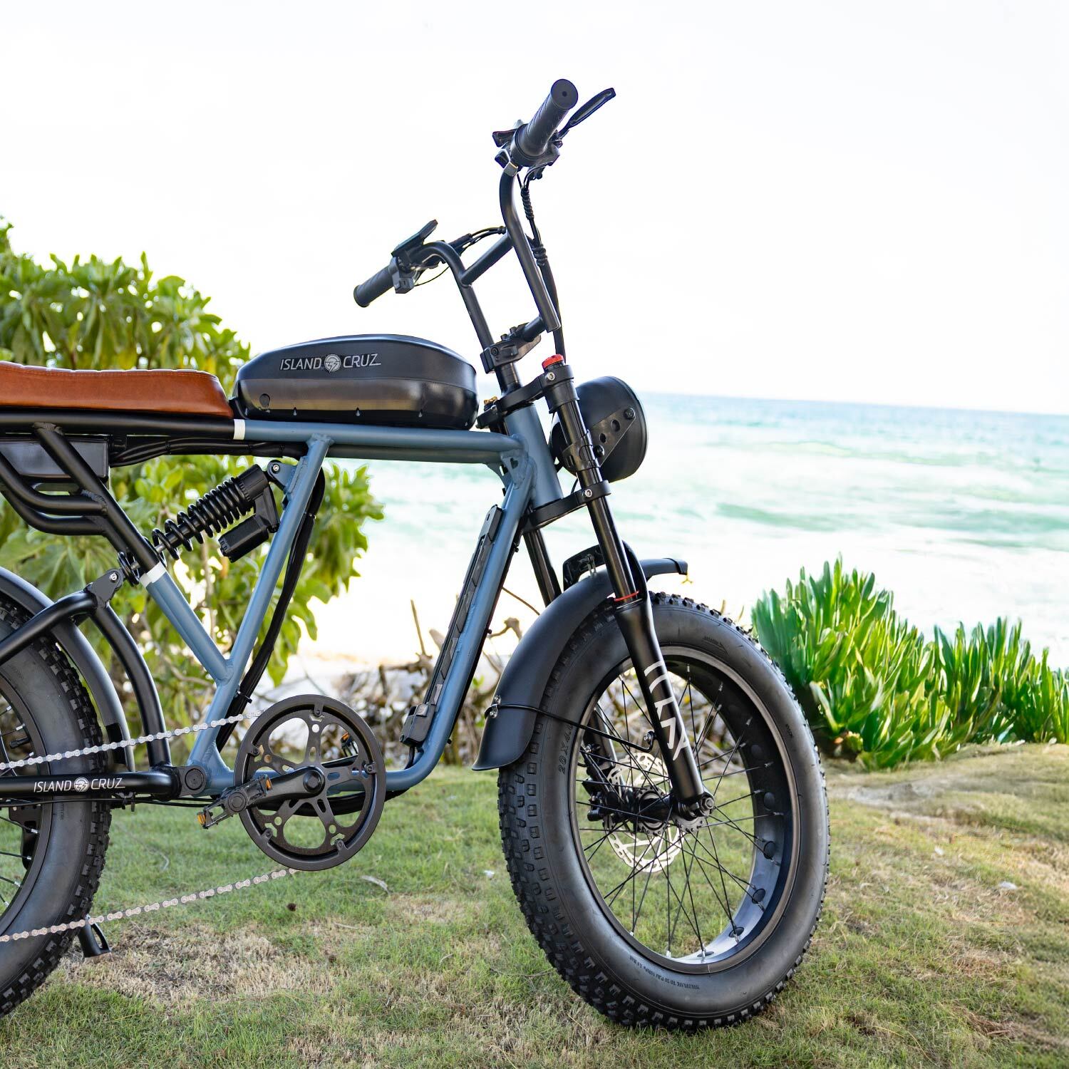 woman riding on island cruzer with orange fenders