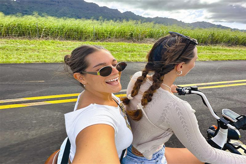 woman riding a scooter