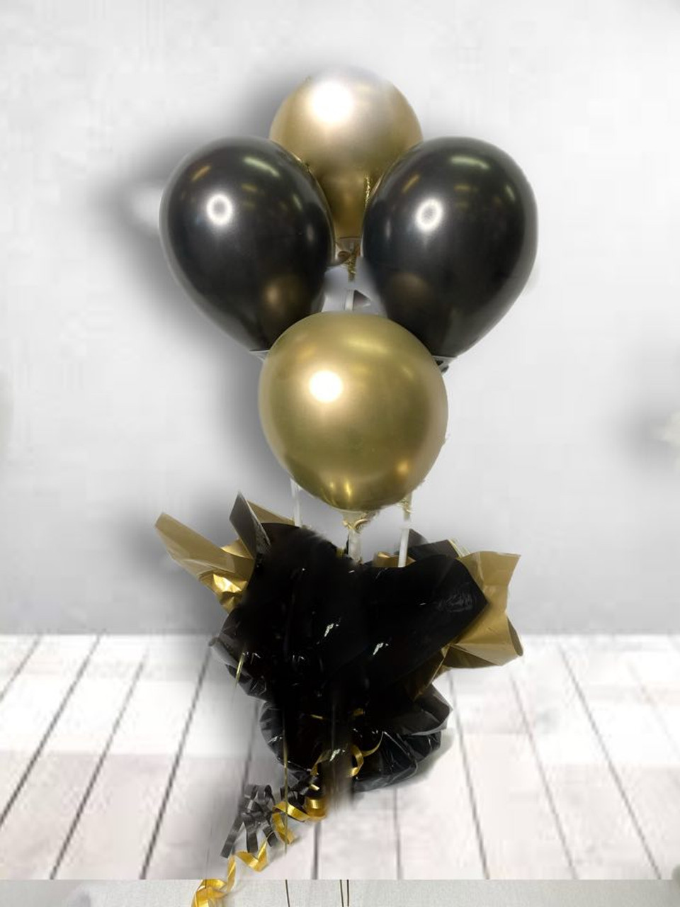 A four balloon (air filled) table arrangement with  spangle.�� Call you choose your colour spangle, balloon and base to compliment your colour scheme. Pre-Order essential.
