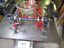 We use a 54" x 96" flat steel (5500#) table to perform any chassis set-up work