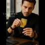 Men placing Gold talisman card into the wallet