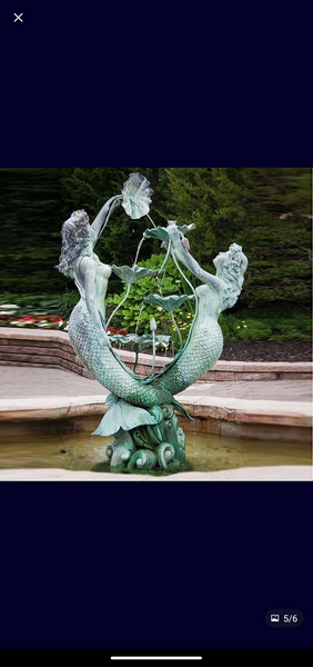 Sis an and friend mermaid fountain.