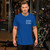 Blue shirt, white wording.