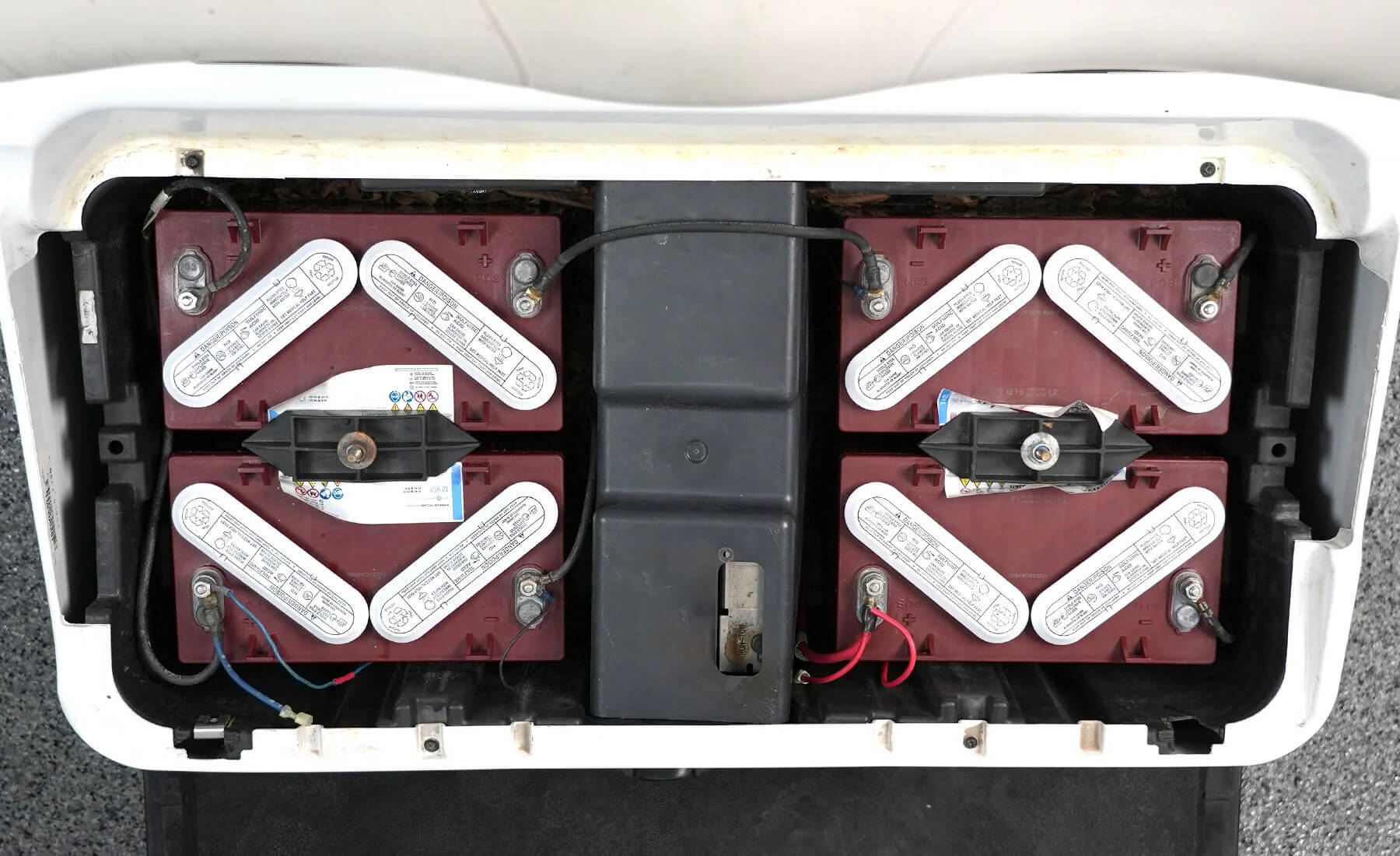 Before: Lead-acid batteries in golf cart