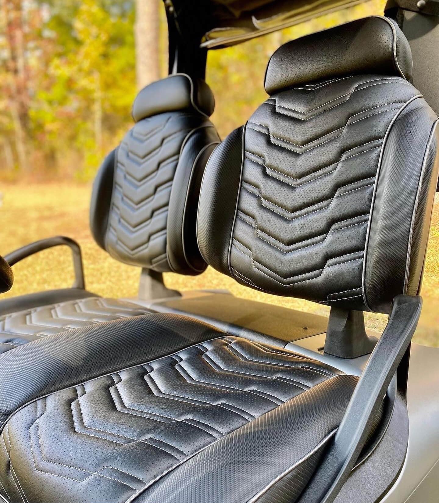 Custom golf cart seats with black leather stiching