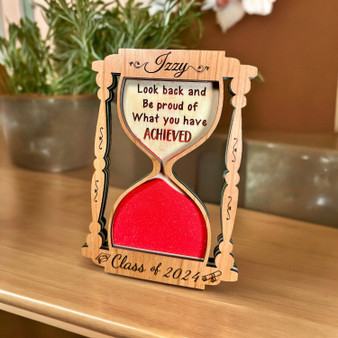 Custom graduation keepsake, wooden hourglass plaque with pink sand design and inspirational quote for a graduate