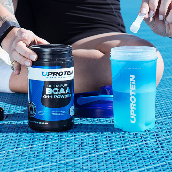 Post Workout Supplements being scooped into shaker