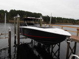 Black boat on 4-piling Lift