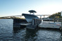 Side view of boat on HarborHoist H2 Floating Boat Lift