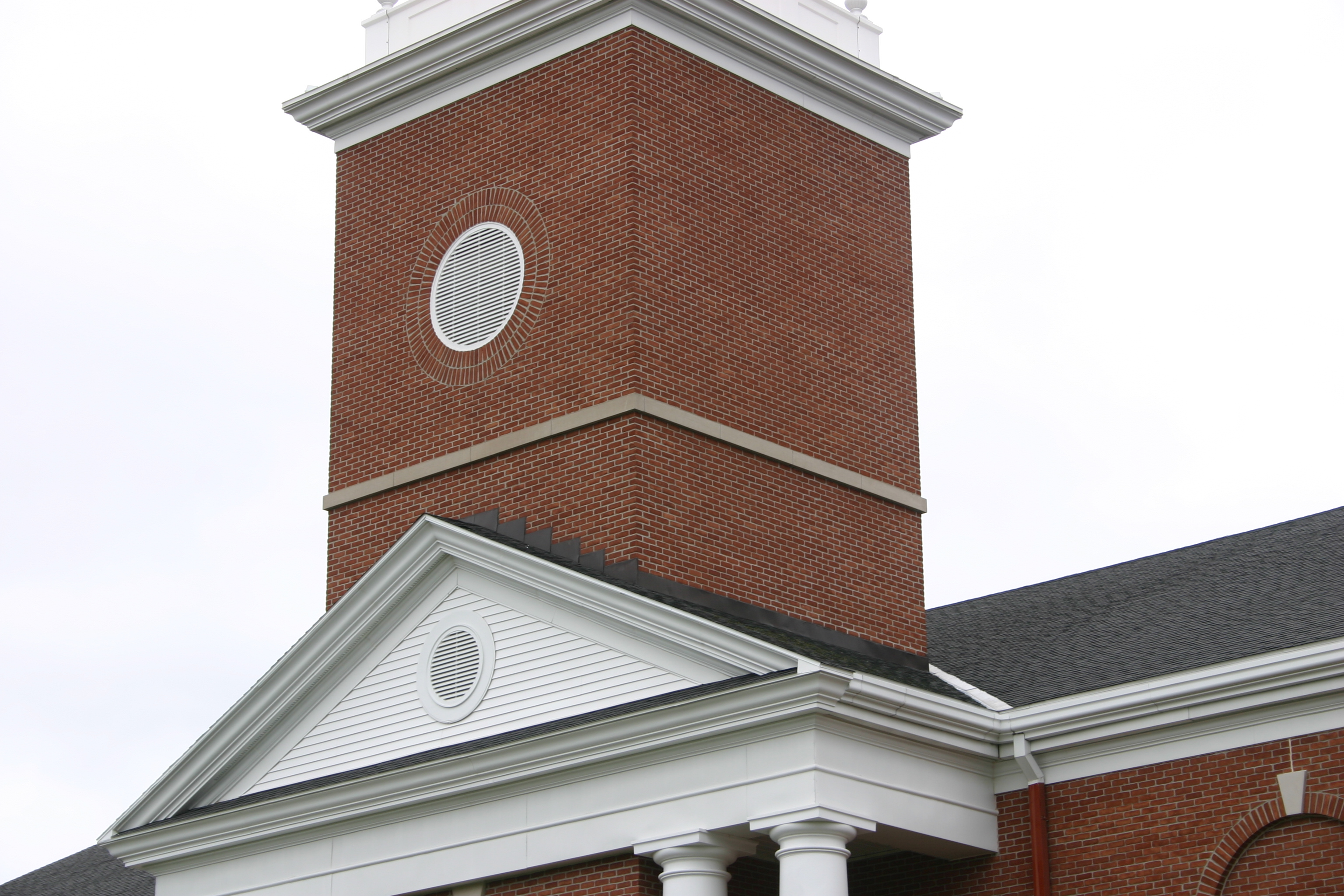 Round gable vents on church