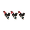 Set of three ID1050X fuel injectors, angled side view, showing red top hats, springs, and O-rings