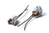 Injector Dynamics Denso female connector pigtail kit, two gray plugs with wire leads on white background
