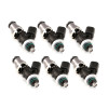 Set of six Injector Dynamics 2600-XDS fuel injectors, angled view showing electrical connectors and green O-rings.