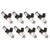 Set of eight Injector Dynamics 2600-XDS fuel injectors, arranged in two rows of four, angled view showing black electrical connectors and silver