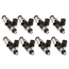 Set of eight Injector Dynamics 1340cc fuel injectors, angled view showing grey tops and green lower O-rings