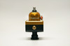 Fuelab 575 Carb Adjustable Mini FPR in gold and black, front view showing adjuster knob and AN fittings.