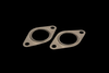 Turbosmart WG38 stainless manifold gasket 2-pack, oval flanges with center bore, angled top view on black