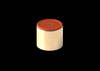 GFB Replacement DV+ Piston, cylindrical body with red top cap, small center hole, angled view